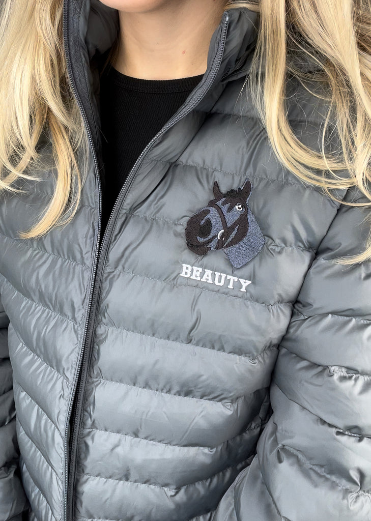 a custom embroidered dog walking gilet bodywarmer featuring a hand-drawn pet portrait, the perfect personalised pet gift for a dog mum