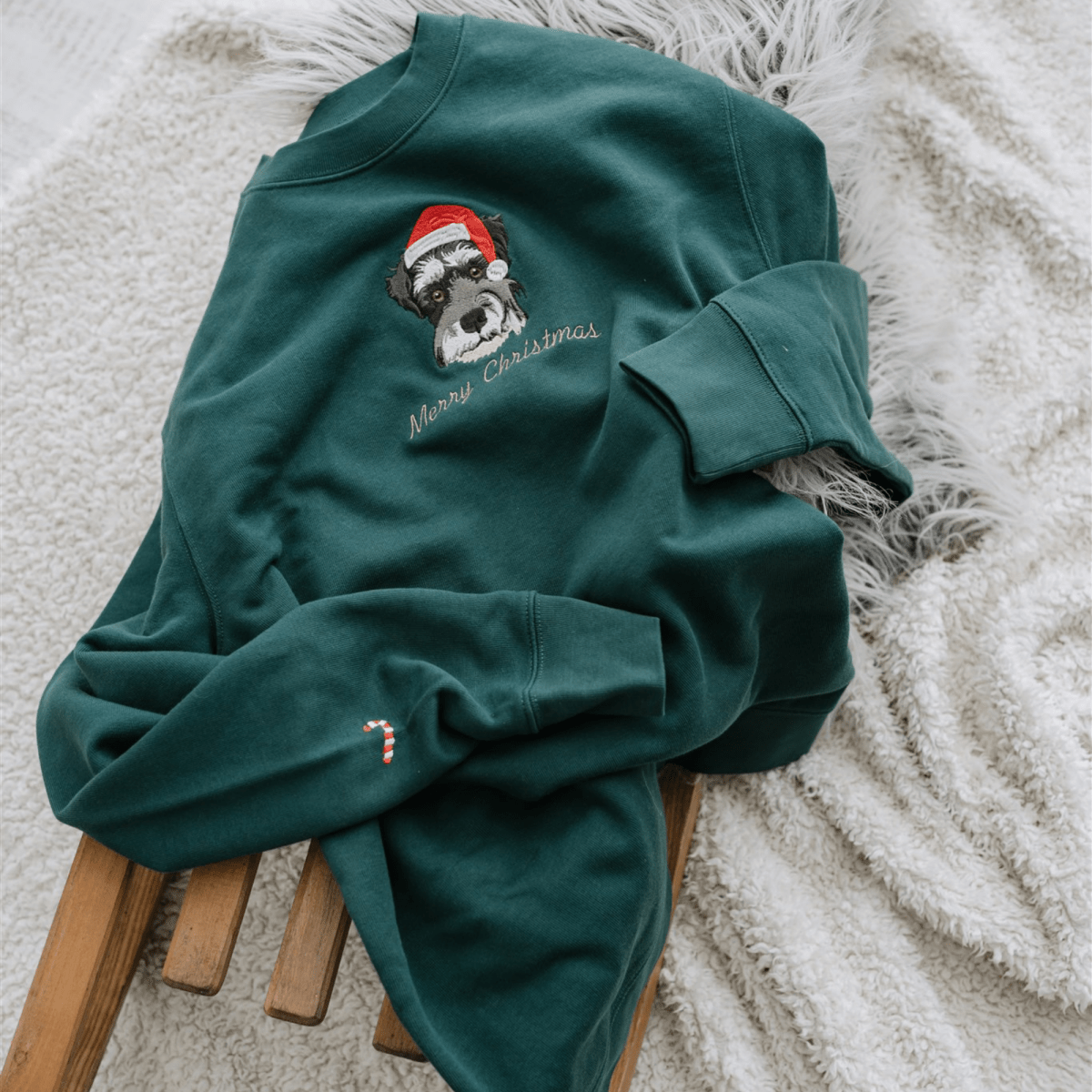Embroidered pet portrait Christmas jumper with the pet's portrait wearing a Santa hat