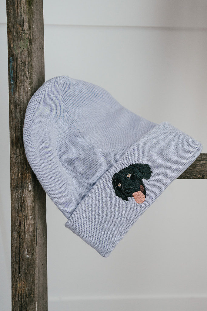 a custom embroidered dog walker beanie featuring a hand-drawn pet portrait, the perfect personalised pet gift for a dog mum