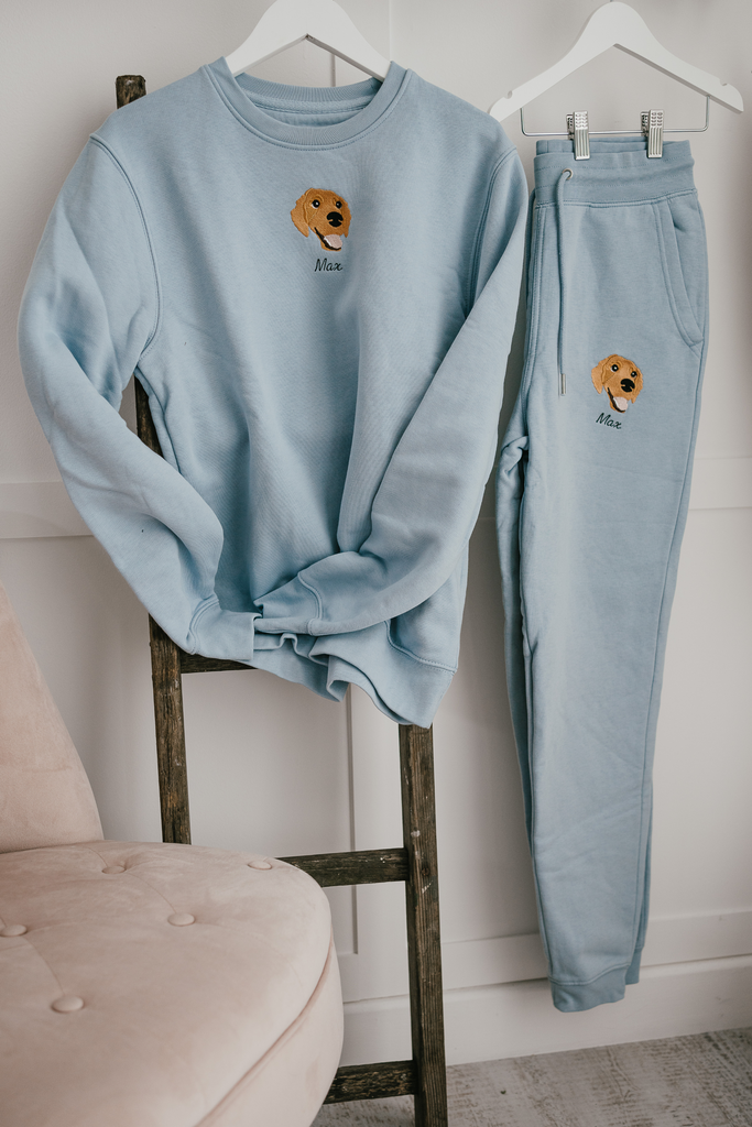 a custom embroidered  sweatshirt and tracksuit set featuring a hand-drawn pet portrait, the perfect personalised pet gift
