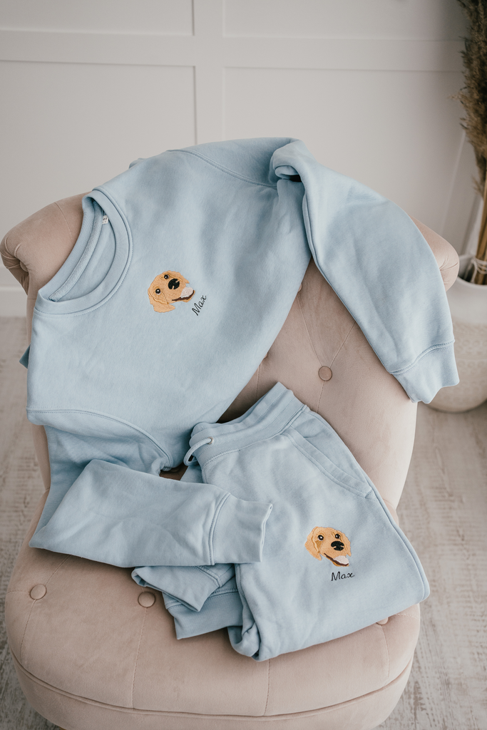 a custom embroidered  sweatshirt and tracksuit set featuring a hand-drawn pet portrait, the perfect personalised pet gift