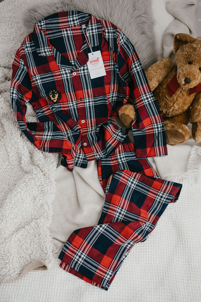 a custom embroidered children's christmas pyjama set featuring a hand-drawn pet portrait, the perfect personalised pet gift 