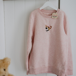 a custom embroidered hoodie featuring a hand-drawn pet portrait, the perfect personalised pet gift.