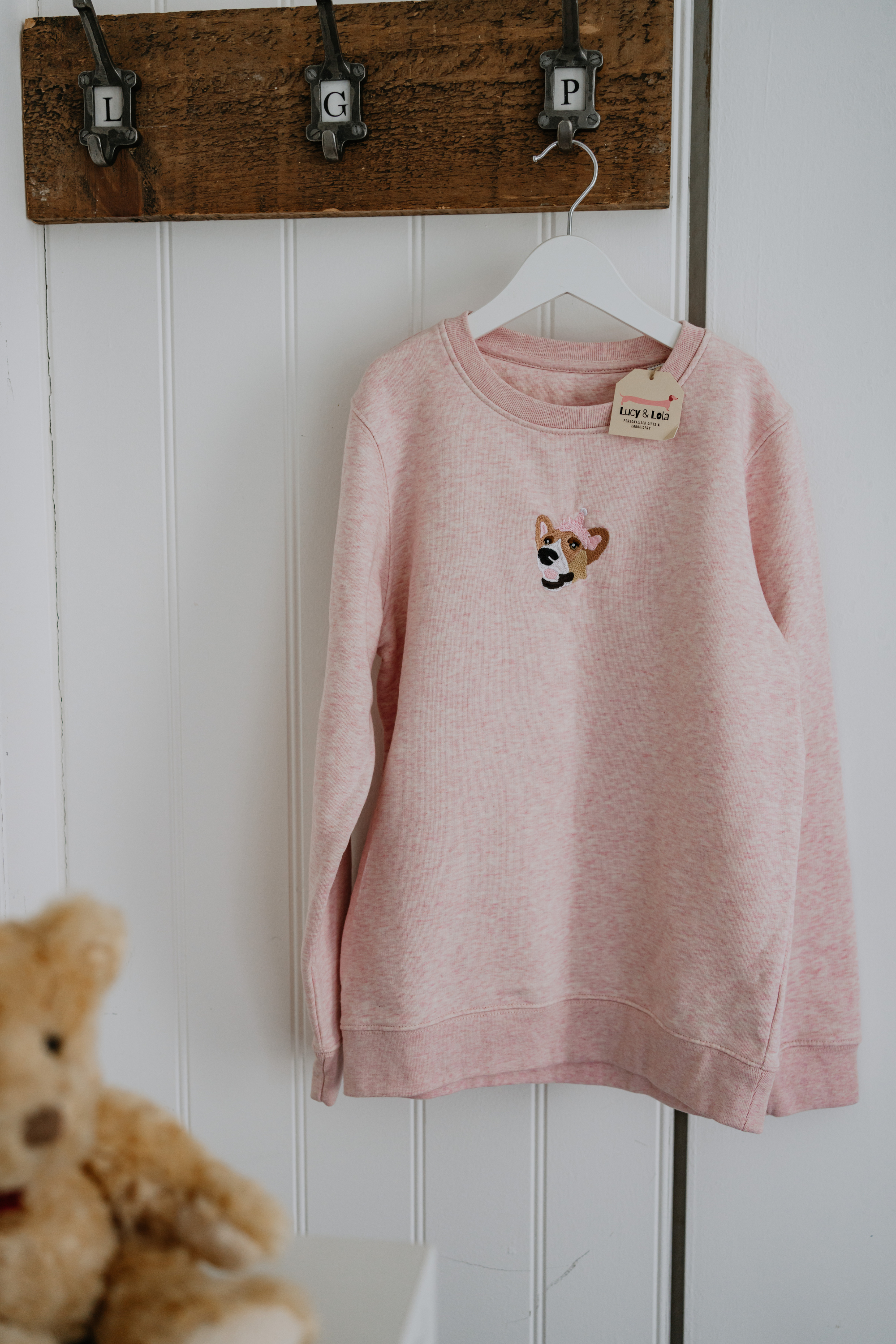 a custom embroidered hoodie featuring a hand-drawn pet portrait, the perfect personalised pet gift.