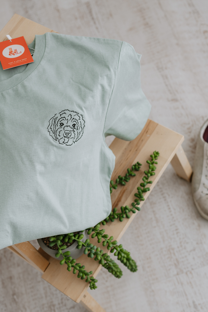 a custom embroidered t shirt featuring a hand-drawn pet portrait, the perfect personalised pet gift 