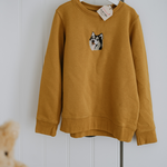 a custom embroidered hoodie featuring a hand-drawn pet portrait, the perfect personalised pet gift.
