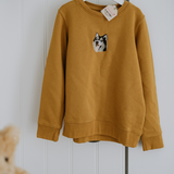 a custom embroidered hoodie featuring a hand-drawn pet portrait, the perfect personalised pet gift.