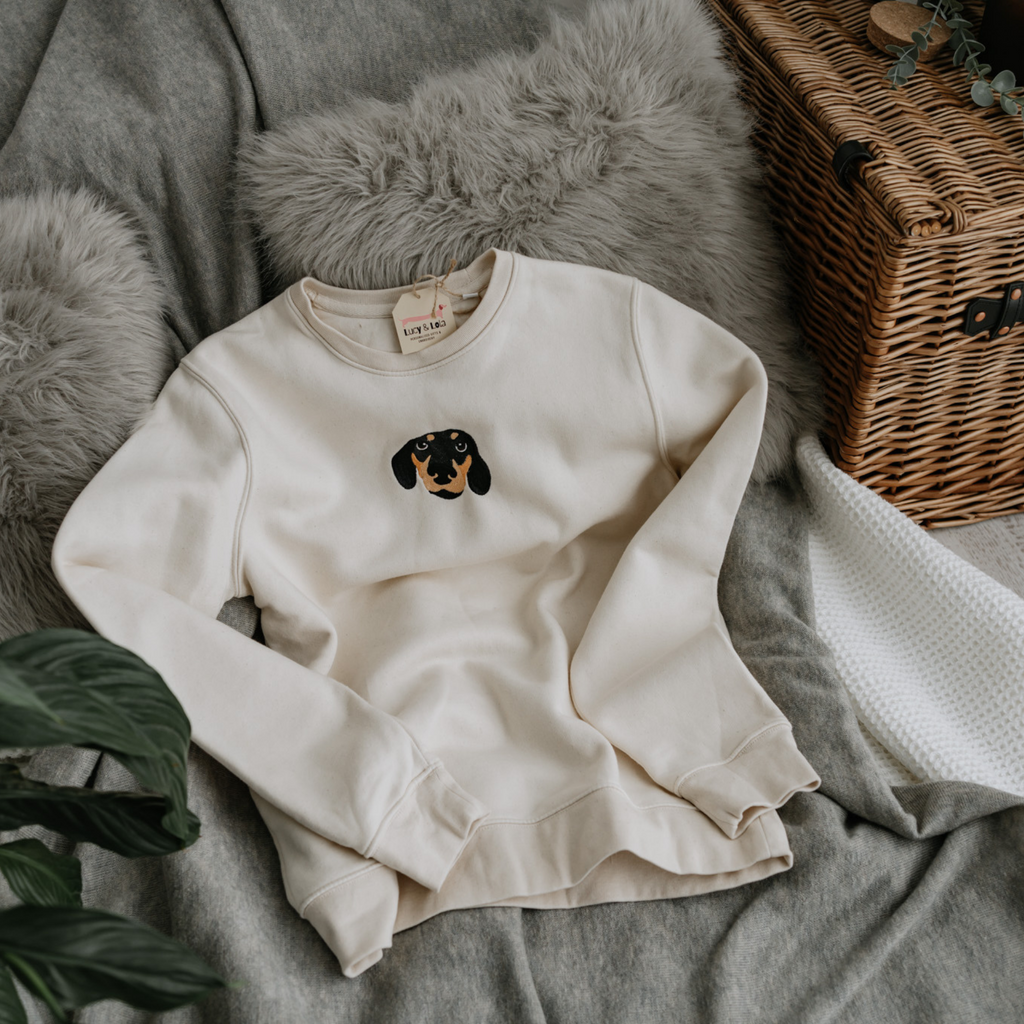 a custom embroidered  sweatshirt and tracksuit set featuring a hand-drawn pet portrait, the perfect personalised pet gift