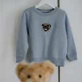 a custom embroidered hoodie featuring a hand-drawn pet portrait, the perfect personalised pet gift.