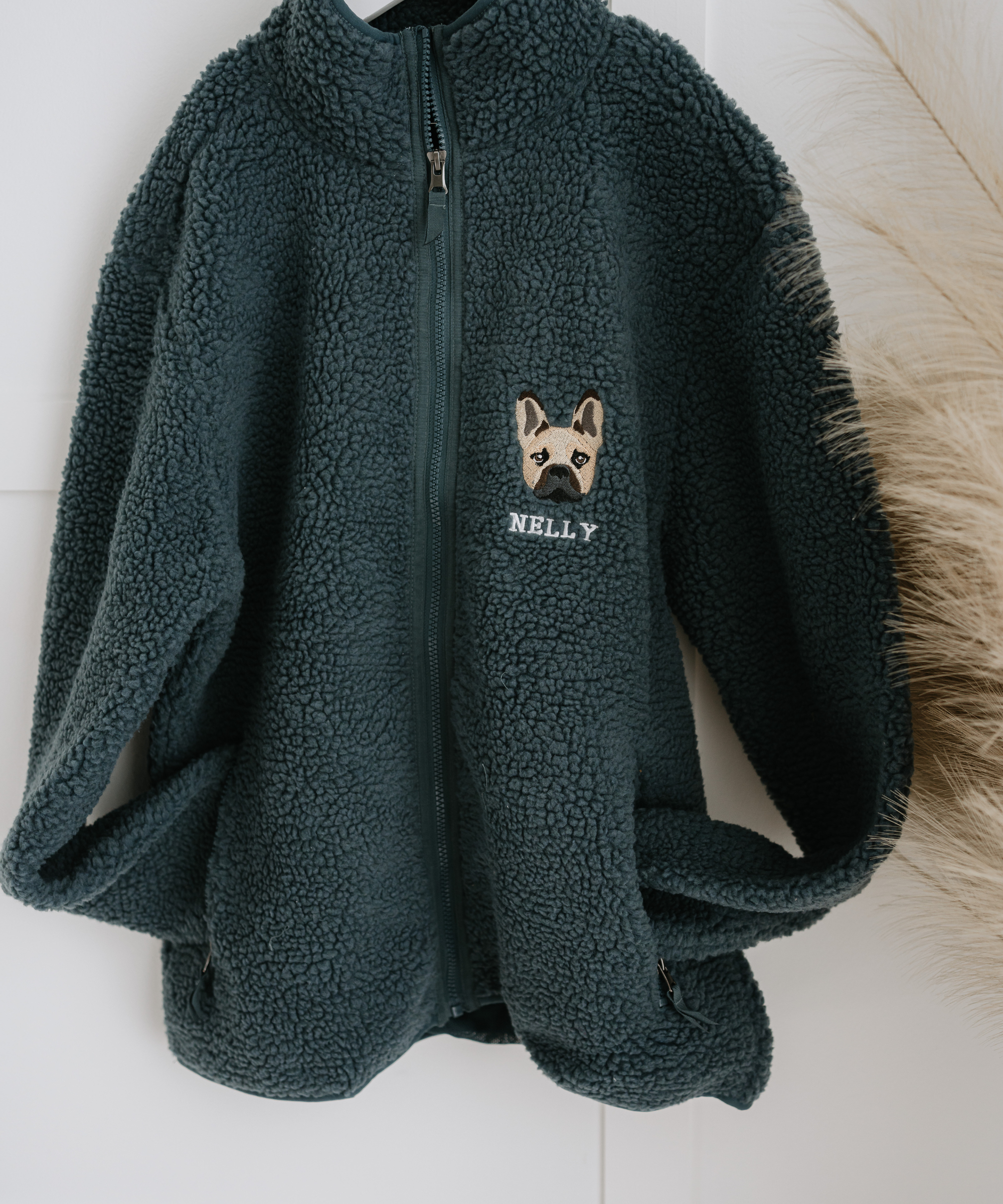 a custom embroidered dog walker sherpa jacket featuring a hand-drawn pet portrait, the perfect personalised pet gift for a dog mum