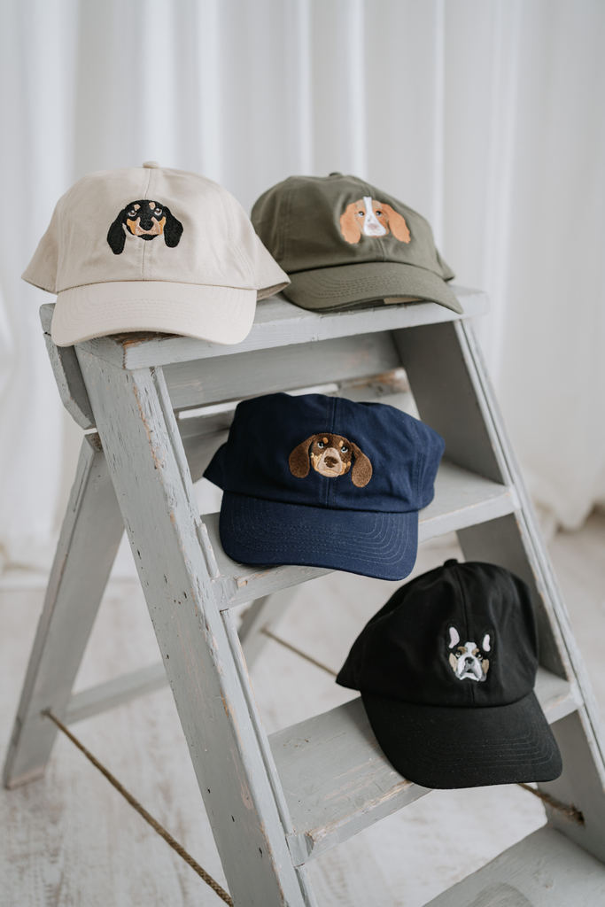 a custom embroidered baseball cap featuring a hand-drawn pet portrait, the perfect personalised pet gift