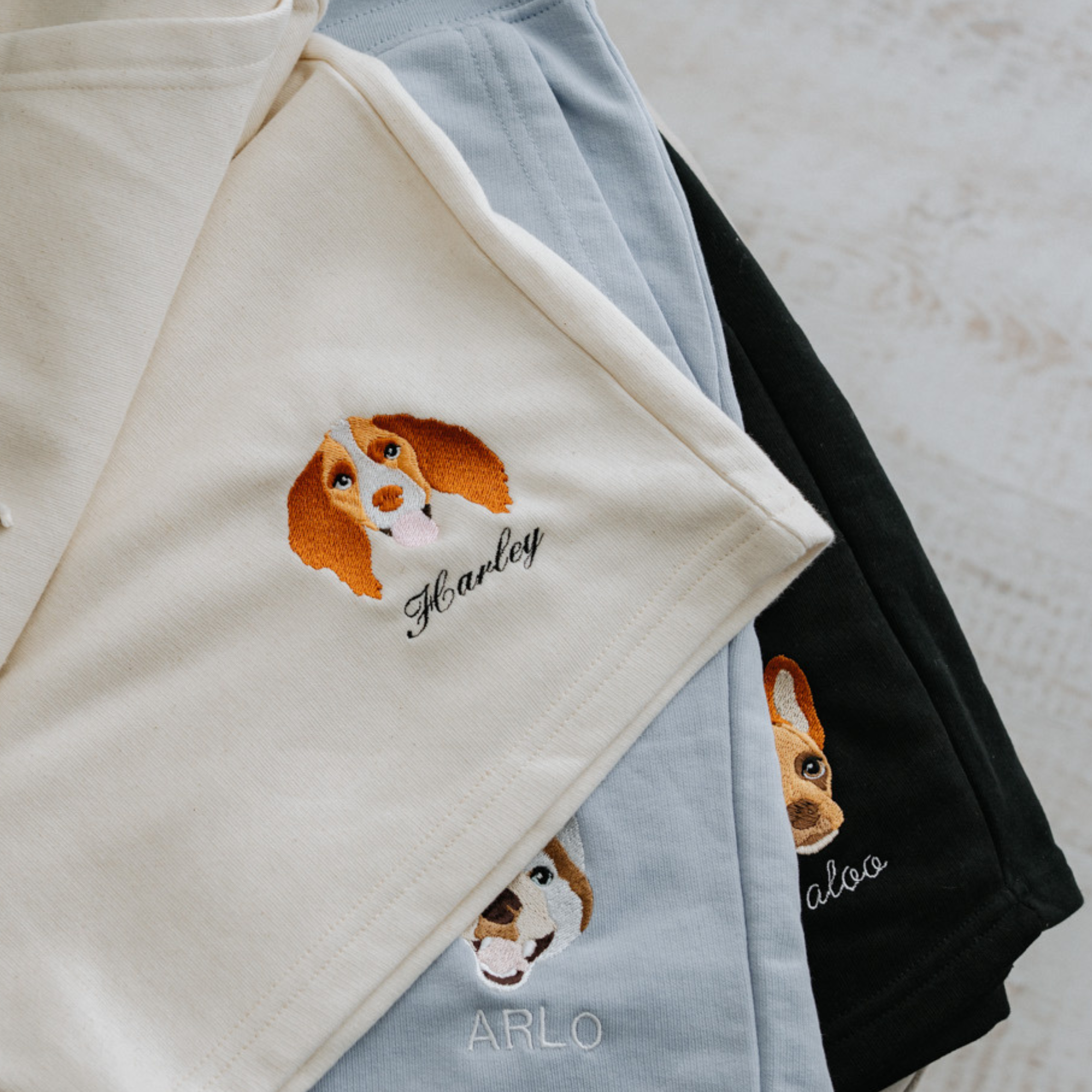 a custom embroidered sweatshirt and short set featuring a hand-drawn pet portrait, the perfect personalised pet gift for a dog mum