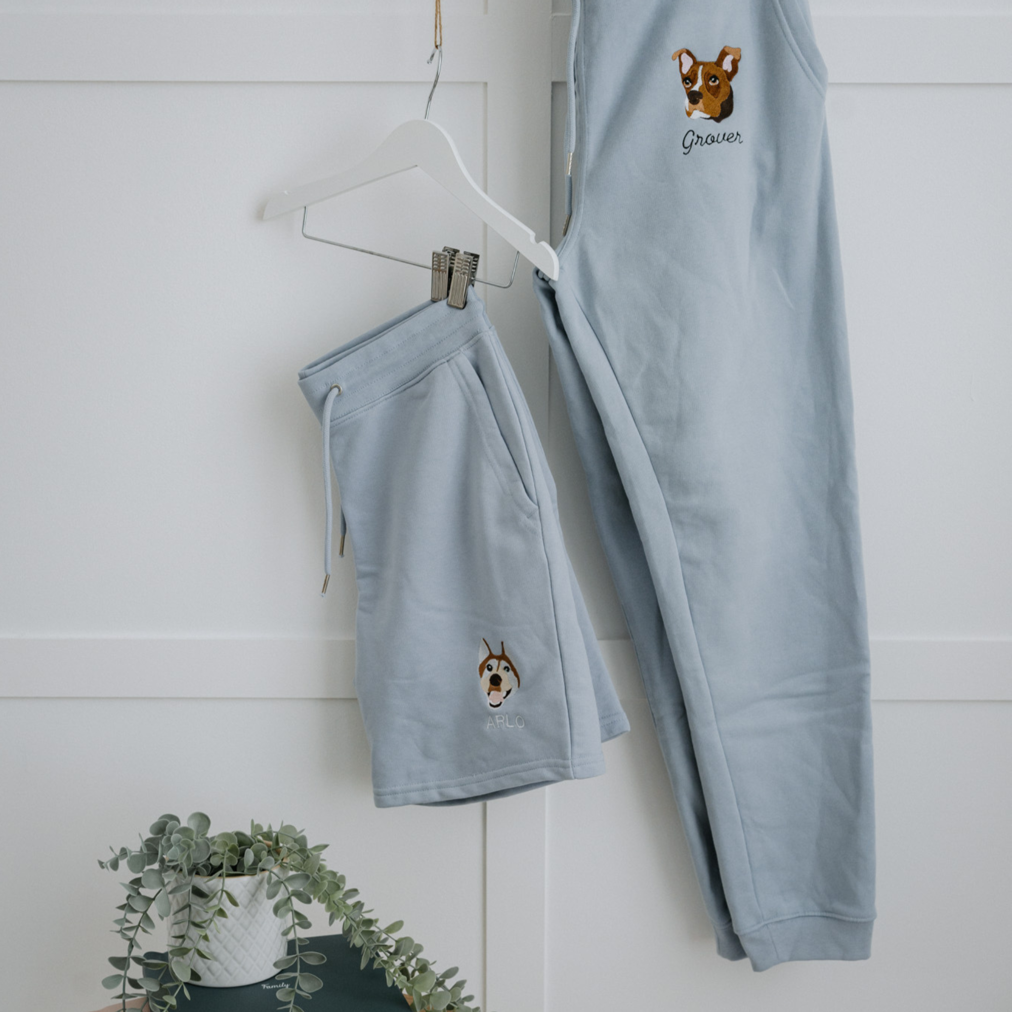 a custom embroidered organic cotton tracksuit bottoms featuring a hand-drawn pet portrait, the perfect personalised pet gift for a dog mum